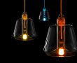 Group shot on black background showing three illuminated Knot lights in blue, yellow and orange.